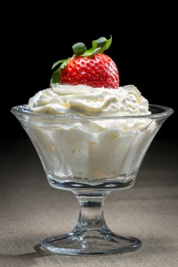 Starwberry with whipped Cream in glass bowl clipart