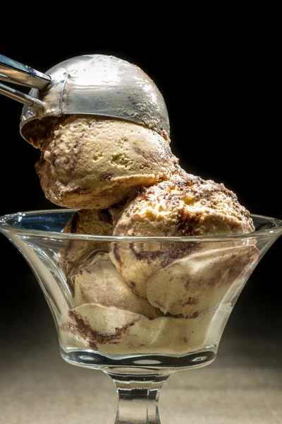 Ice cream with metallic spoon — Stock Photo, Image