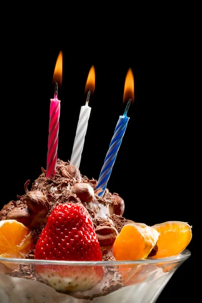 stock image Burning candle on ice cream