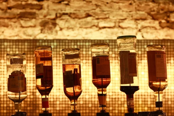 stock image Six bottles on a bar