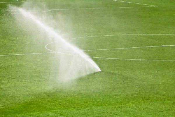 Sprinklerer on a football field — Stock Photo, Image