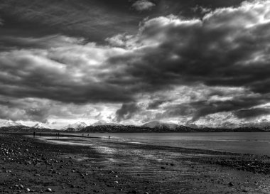 Storm clouds over an Alaskan beach clipart