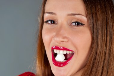 Portrait of a beautiful girl with a heart-shaped sugar clipart