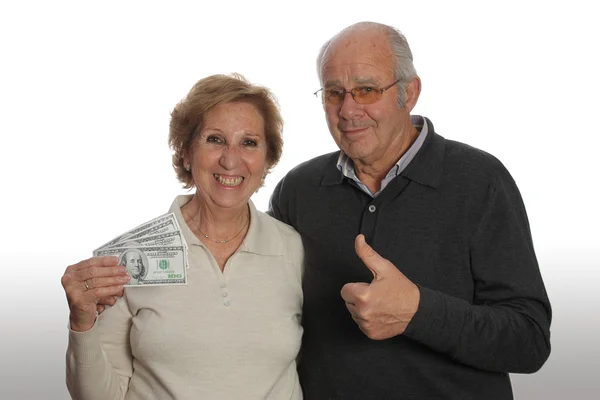Älteres Ehepaar mit Geld Stockfoto