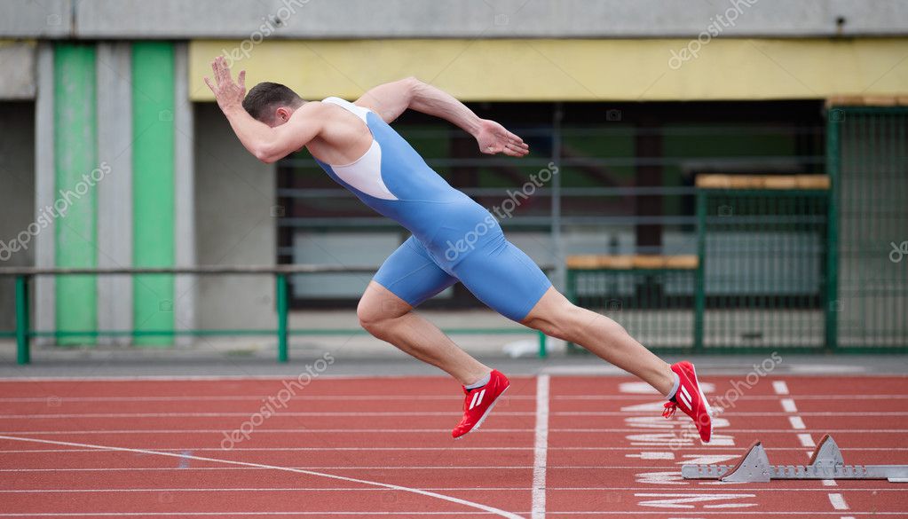 Professional sprinter's explosive start on the running track — Stock