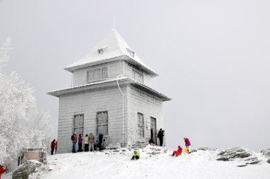 Observation hut on the hill in winter Sitno clipart