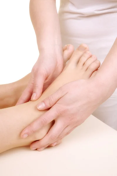 Massage the feet of a young woman — Stock Photo, Image