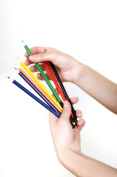 Lápices de colores en las manos de las niñas aisladas en blanco —  Fotos de Stock