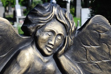 Detail of a small angel on the tombstone clipart