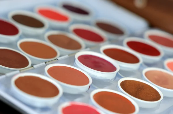 Palety kolorowe cienie do powiek makijażu jako tło — Zdjęcie stockowe