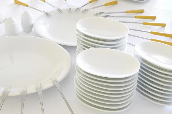 Empty plates with forks — Zdjęcie stockowe