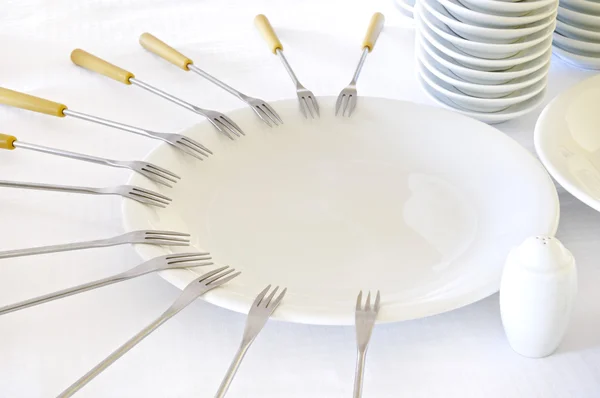 Empty plates with forks — Zdjęcie stockowe