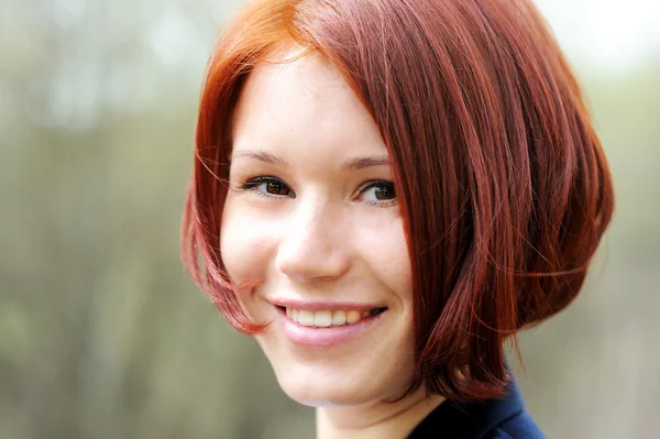 Closeup portrait of beautiful woman with red hair — Stock Photo, Image
