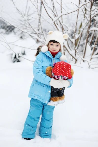 Cute toddler girl in snowsuit posing outdoors — Stock Photo, Image