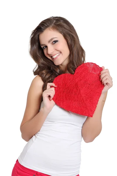Attractive brunette showing a big heart — Stock Photo, Image