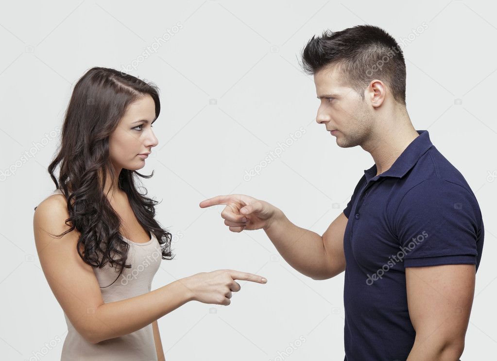 Couple pointing to each other