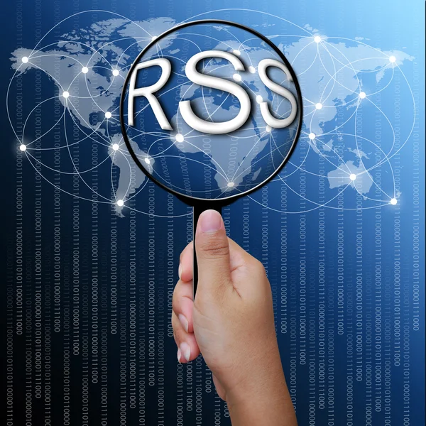 Rss フィードは、虫眼鏡で単語ネットワークの背景 — ストック写真