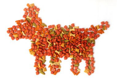Pile of dog food bits on white background clipart