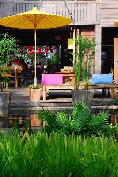 Stock image Yellow umbrella and Couch in Thai Resort