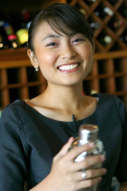 Asian pretty bartender at work clipart