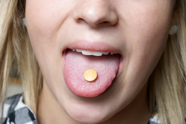 Taking a Vitamin C — Stock Photo, Image