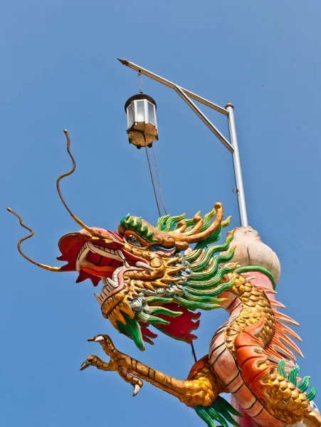 Golden dragon claws extended — Stockfoto