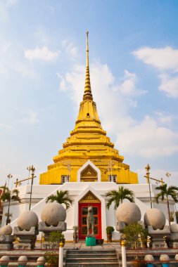 Golden pagoda in front of a horse waiting for a Vertical photo clipart