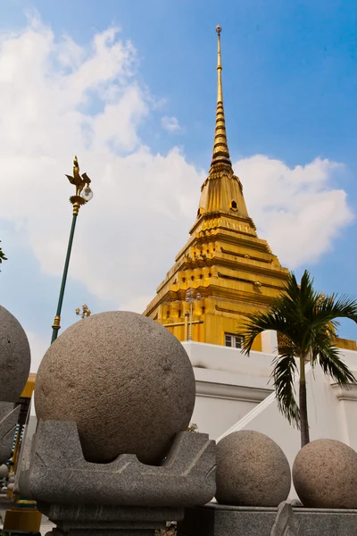 Golden pagoda in front of the stone round the corner — Stock Photo, Image