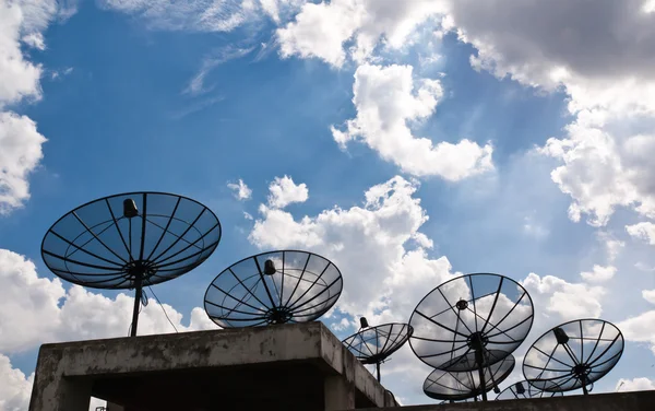 stock image Satellite dishes that are several black