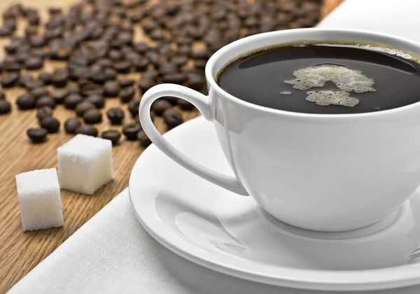 Stock image Coffee cup, beans and lump sugar