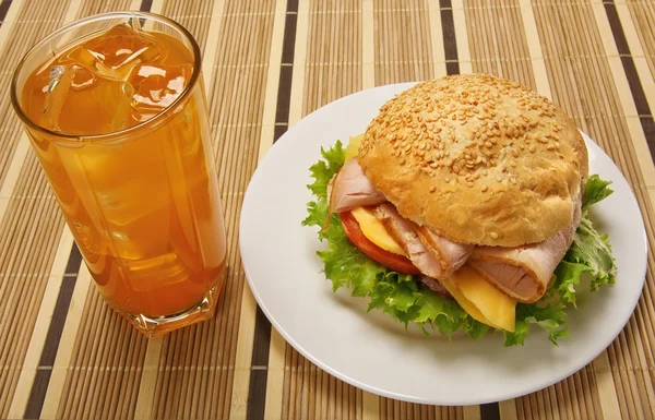 Sandwich and glass of orange juice — Stock Photo, Image
