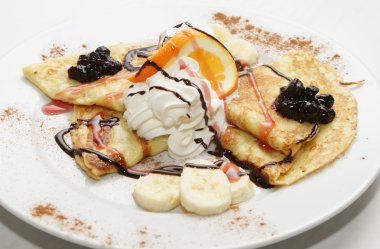 Pancakes with cheese, cream, banana, chocolate...