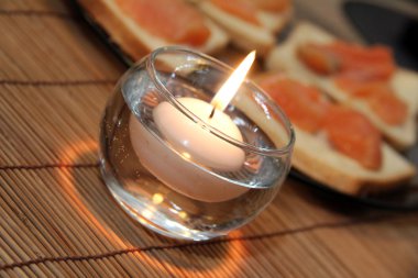 Candle on the table refectory clipart