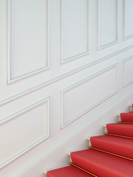 Uma escada clássica com um tapete vermelho . — Fotografia de Stock