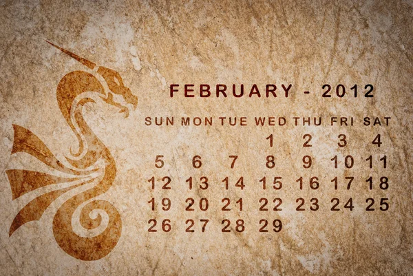 2012 год календаря Дракона на старинной бумаге — стоковое фото