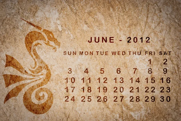 2012 год календаря Дракона на старинной бумаге — стоковое фото