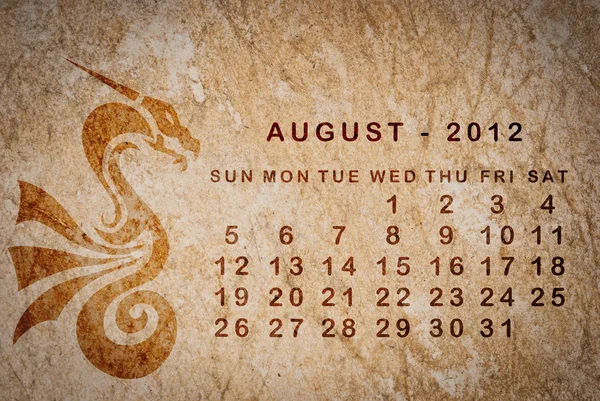 2012 rok draka kalendáře na staré vinobraní papír — Stock fotografie