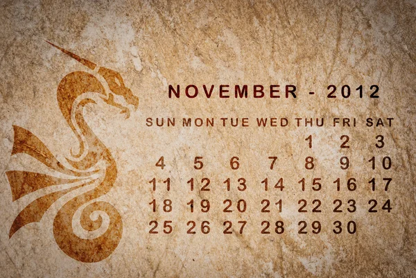 2012 year of the Dragon calendar on old vintage paper — Stock Photo, Image