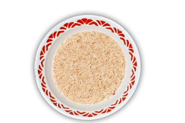 Коричневый рис в миске — стоковое фото