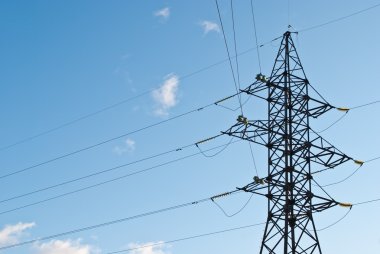 High power electrical pole on a sunny day clipart