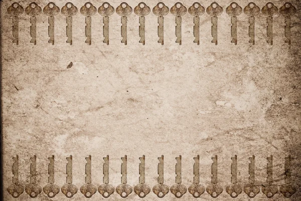 Llaves oxidadas sobre papel viejo — Stockfoto