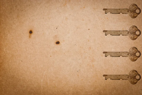 Llaves oxidadas sobre fondo de papel viejo — Foto de Stock