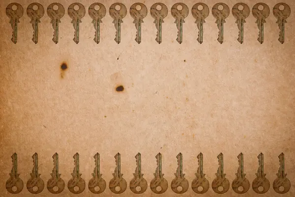 Eski kağıt arka plan üzerinde paslanmış tuşları — Stok fotoğraf