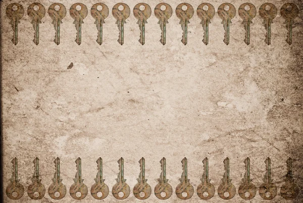 Rozsdás kulcsokat a régi papír háttér — Stock Fotó
