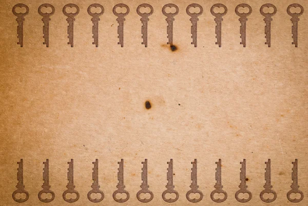 Rezavý klávesy na staré papírové pozadí — Stock fotografie