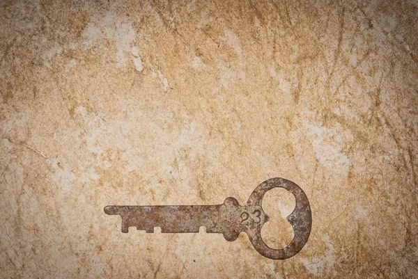 Rostiga nycklar på gamla papper bakgrund — Stockfoto