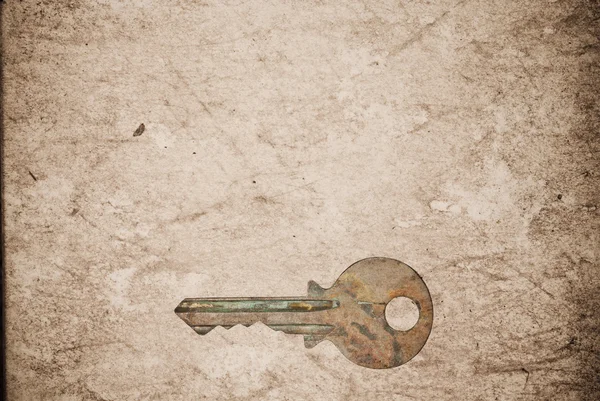 旧纸张背景上生锈的钥匙 — 图库照片