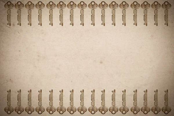 古い紙の背景に錆びた鍵 — ストック写真