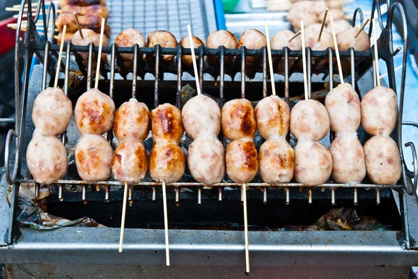 Grill fresh Thai eastern sausages on sticks — Stock Photo, Image