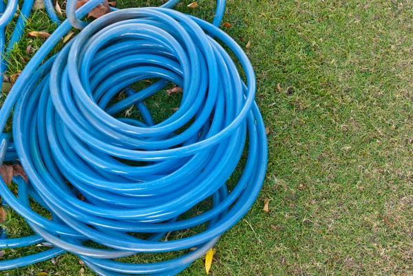 Blue garden water hose stack together — Stock Photo, Image